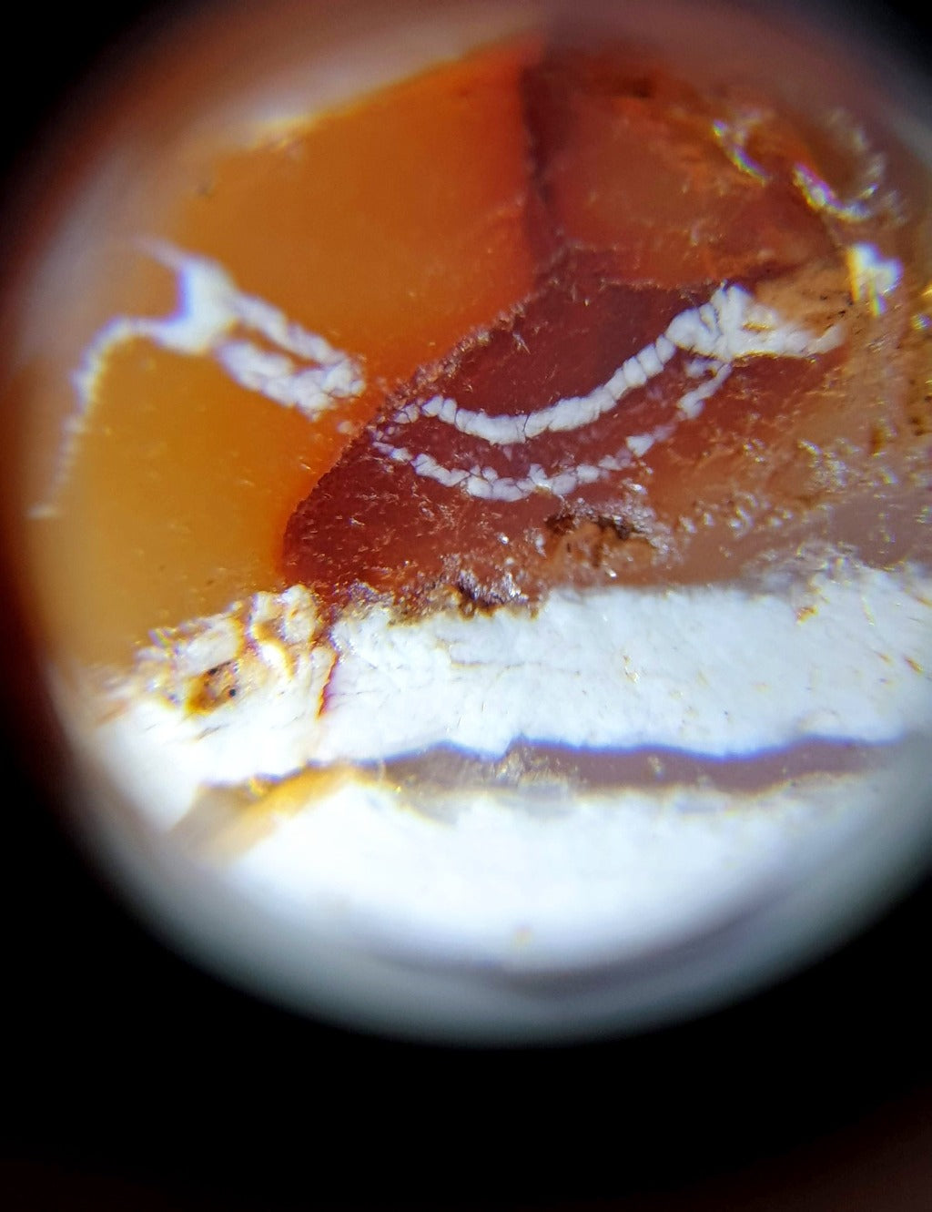 ancient Dzi bead made from Carnelian, showcasing a unique and highly sought-after Four Diamond Eye-In-Eye & Wave motif. This bead is exceptionally rare, adding to its collectability and value. The intricate design combines protective symbolism with the fluidity and power of waves, making it a remarkable piece of ancient craftsmanship and spiritual significance."