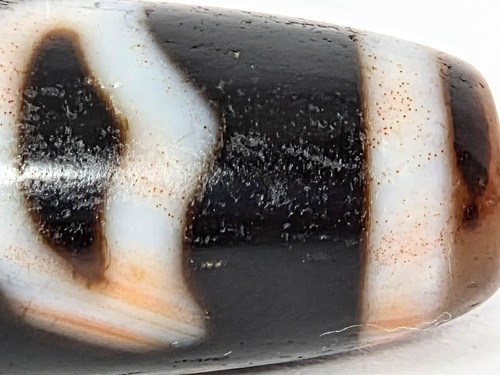Vintage Lotus Bud Dzi Bead with natural bloodspot patterns on agate surface, brown and white striped design