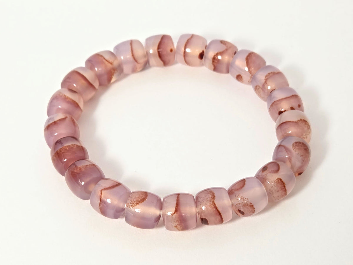 N-030526-CB2 chalcedony bracelet overhead, round mauve-rose beads, gold rondelle spacers, cinnabar inclusions, unretouched