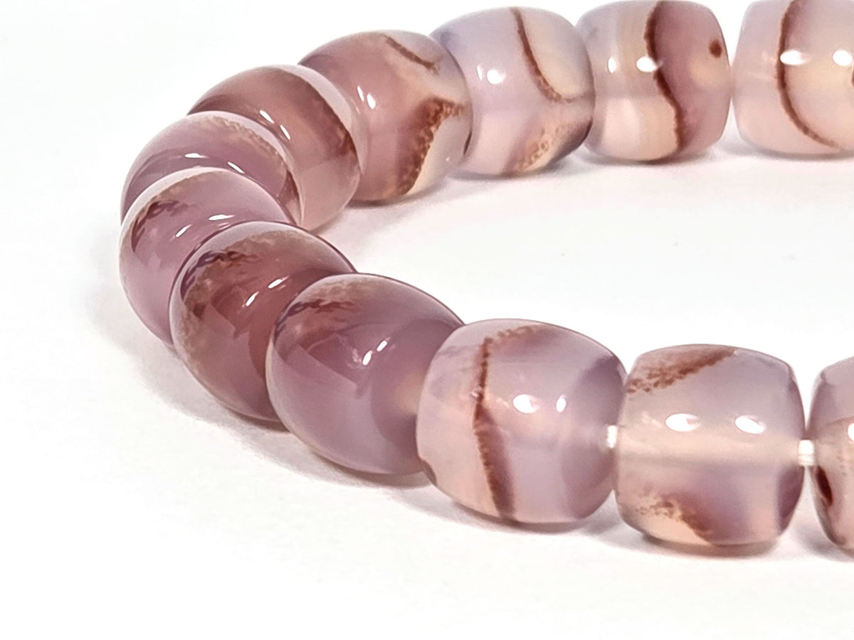 N-030526-CB2 side arc, semi-translucent mauve-rose beads, gold rondelle spacers, warm banding, unretouched