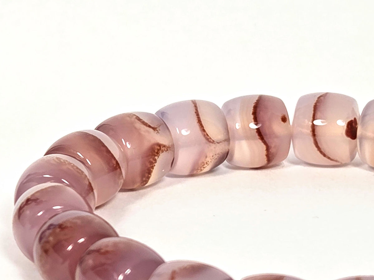 N-030526-CB2 bead detail, dusty mauve-rose chalcedony, cinnabar dot clusters, gold spacers between beads, unretouched