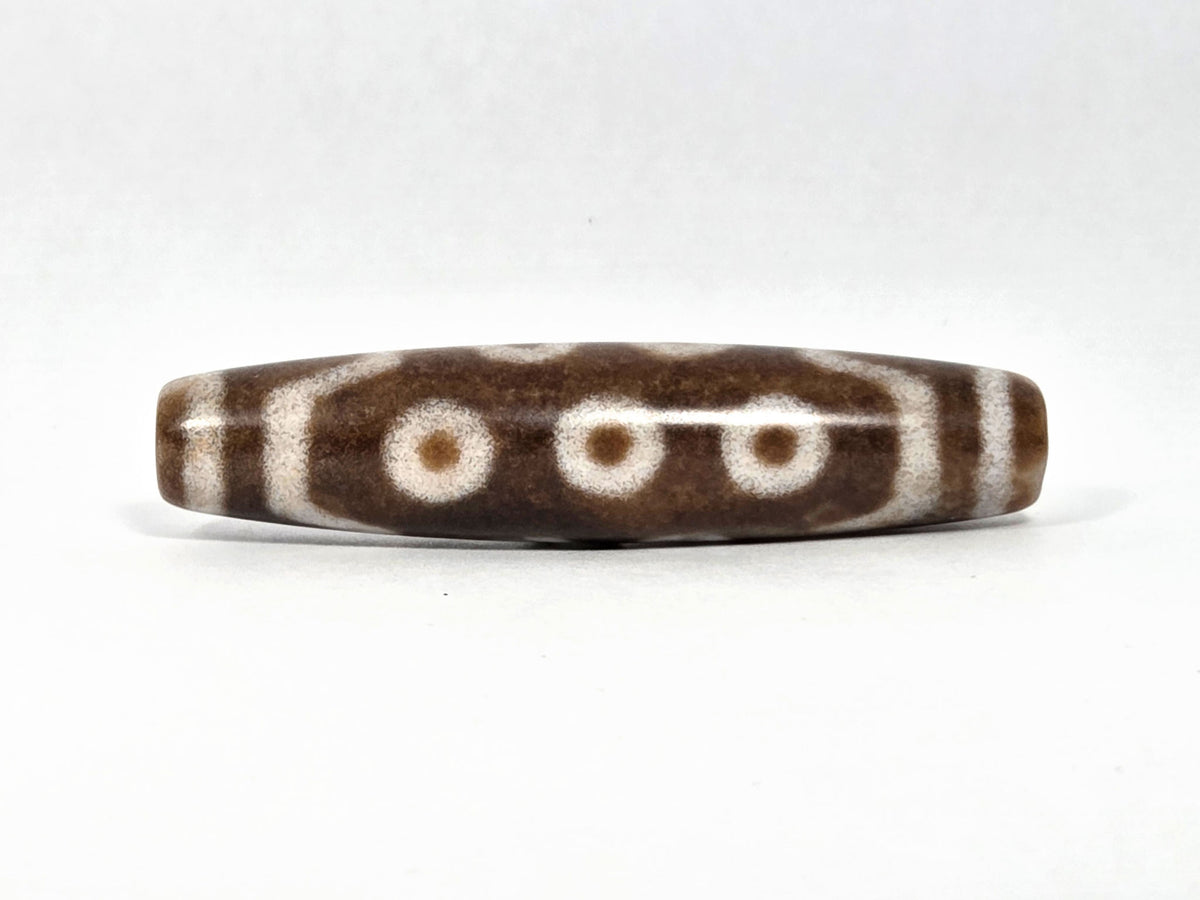 N-083126-10E new ten eye dzi bead 58.3x13.4mm warm brown agate matte front face unretouched