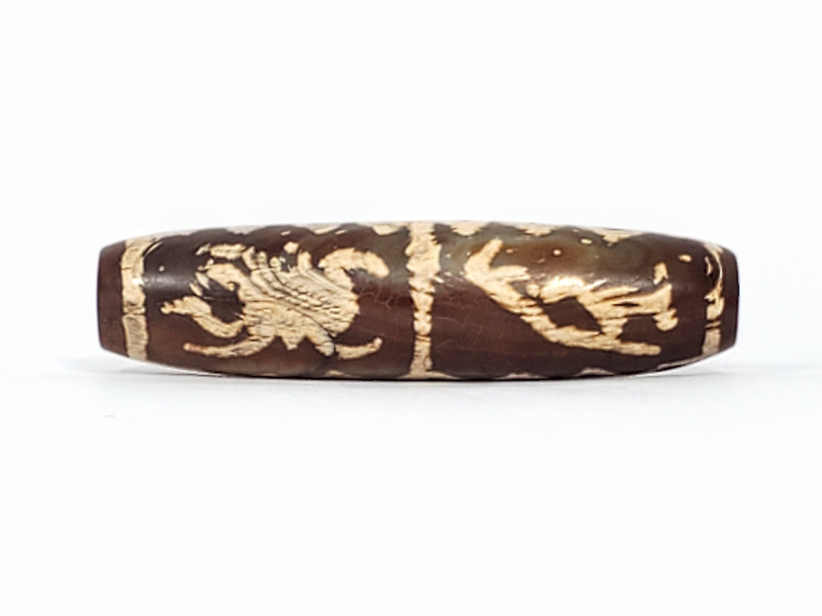 Tibetan dzi bead brown agate carved phoenix tiger motif cream etched pattern cylindrical antique patina drilled bead