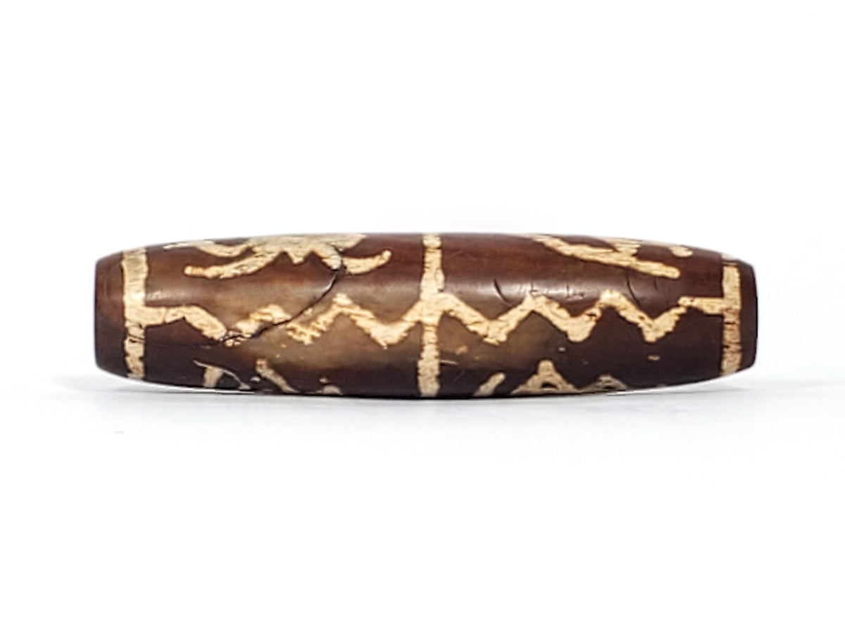 Ancient dzi bead brown agate zigzag wave motif cream etched pattern aged patina elongated barrel shape