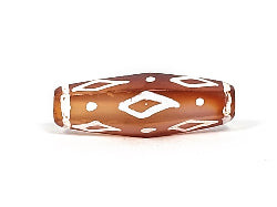 Rare hexagonal carnelian dzi bead with white diamond eye motifs, aged patina, visible drill holes, warm amber-brown agate surface
