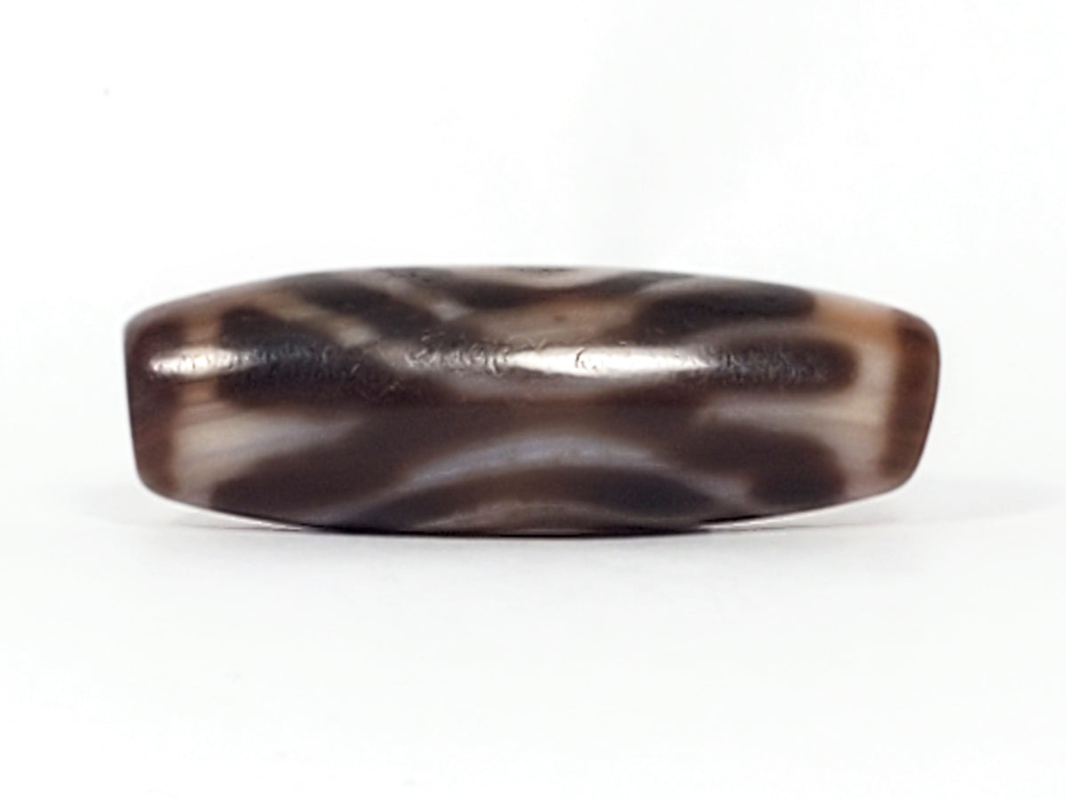 Ancient Tibetan dzi bead, double heaven's gate motif, dark brown agate, wavy white patterning, polished surface with aged patina