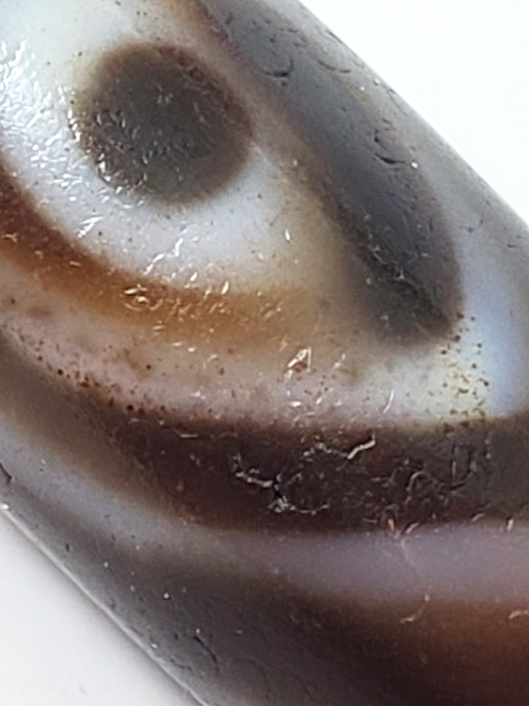 Ancient Tibetan double heaven's gate dzi bead, brown agate, white eye motifs, dark bloodspots, weathered patina, natural inclusions