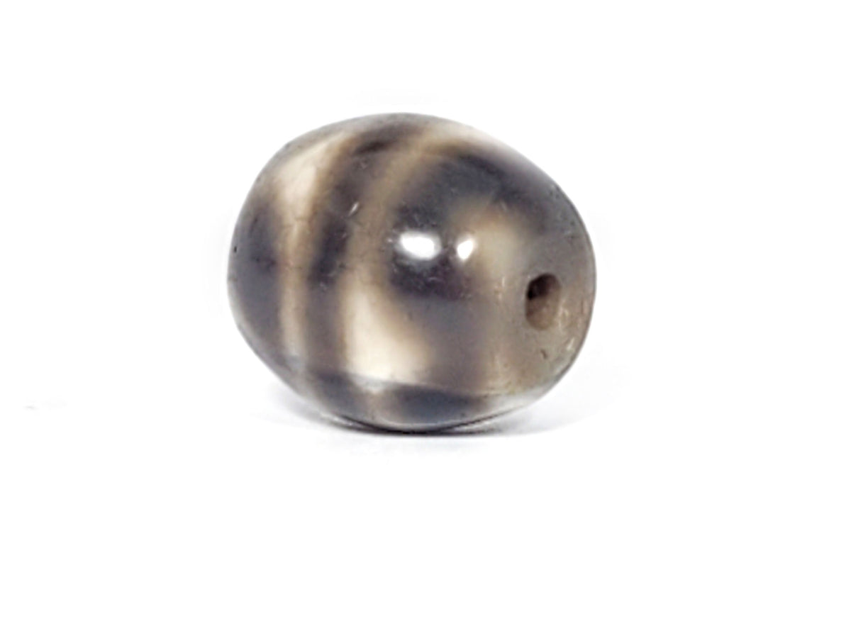 Ac-021724-TT ancient round tiger tooth dzi, sixth face view, drill hole side, unretouched