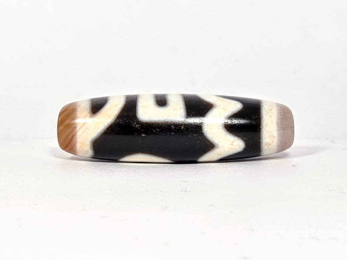 Antique Tibetan Dzi bead Four Activities motif black white agate zigzag pattern bloodspots aged patina