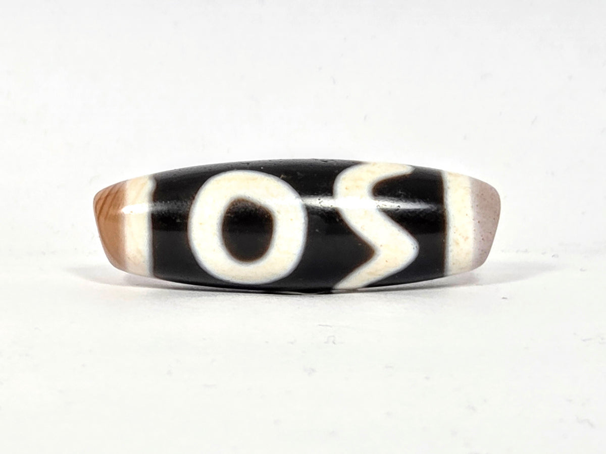 Antique Tibetan dzi bead, four activities motif, black white agate, eye and wave pattern, bloodspots, aged patina, barrel shape