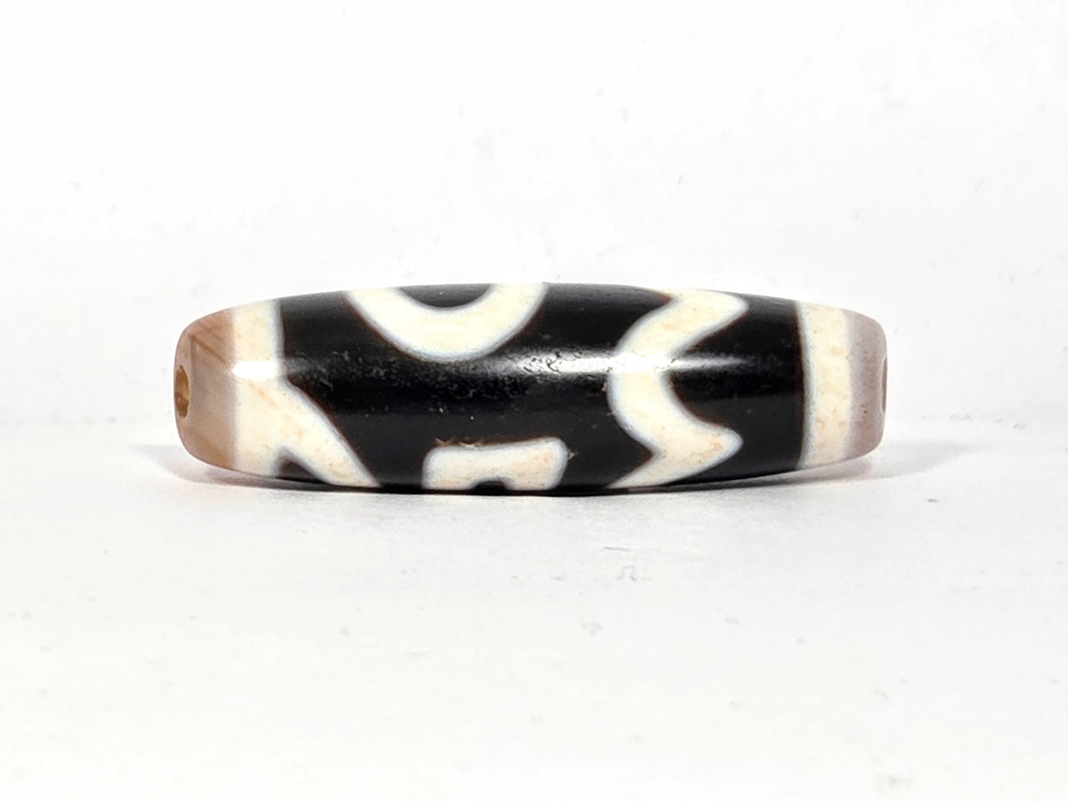 Antique Tibetan dzi bead, four activities motif, black white agate, visible drill holes, natural patina, bloodspots