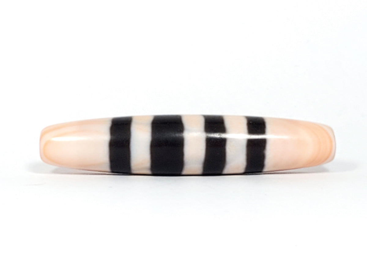 Antique Nepalese seven-stripe chung dzi bead, peach agate, bold black bands, high polish, elongated barrel form