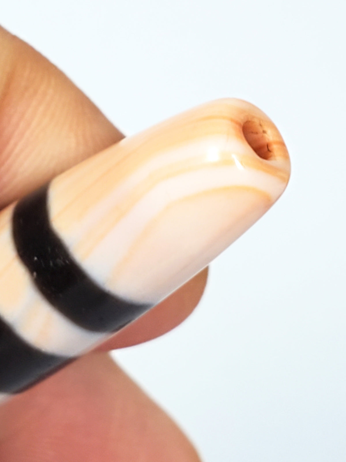 Antique Nepalese seven stripe chung dzi bead, cream agate with brown stripes, visible bloodspots, drill hole, aged patina