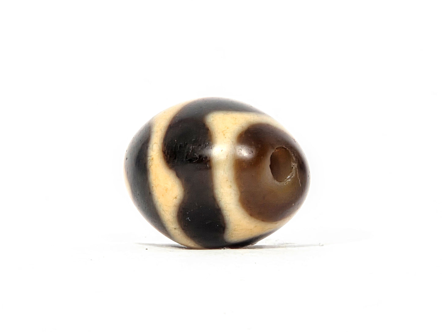 Antique Tibetan Round Dzi Bead featuring Double Wave Motif (110325)