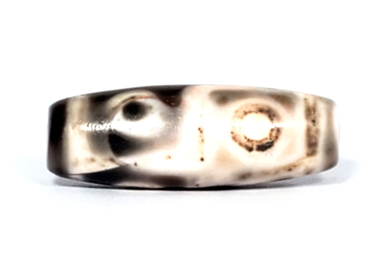 Six Eye Dzi bead, pale warm-brown agate with cinnabar bloodspots, 35mm barrel shape