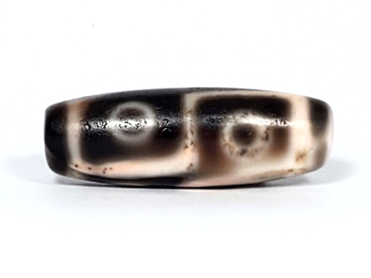 Six Eye Dzi bead, pale warm-brown agate with cinnabar bloodspots, 35mm polished agate bead