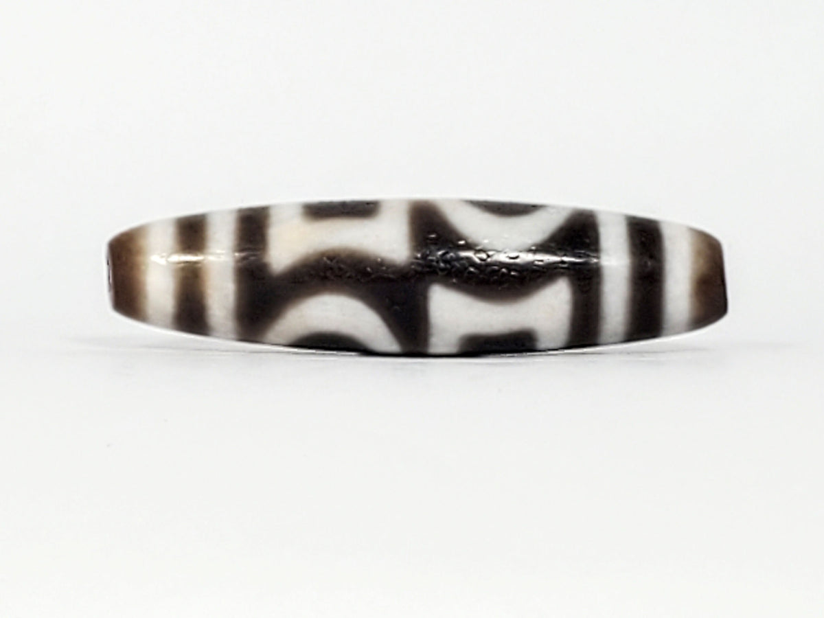 Antique heaven earth gate dzi — top profile, arc pattern, micro-crackle ridge line, warm brown agate ends, At-0426-DHE
