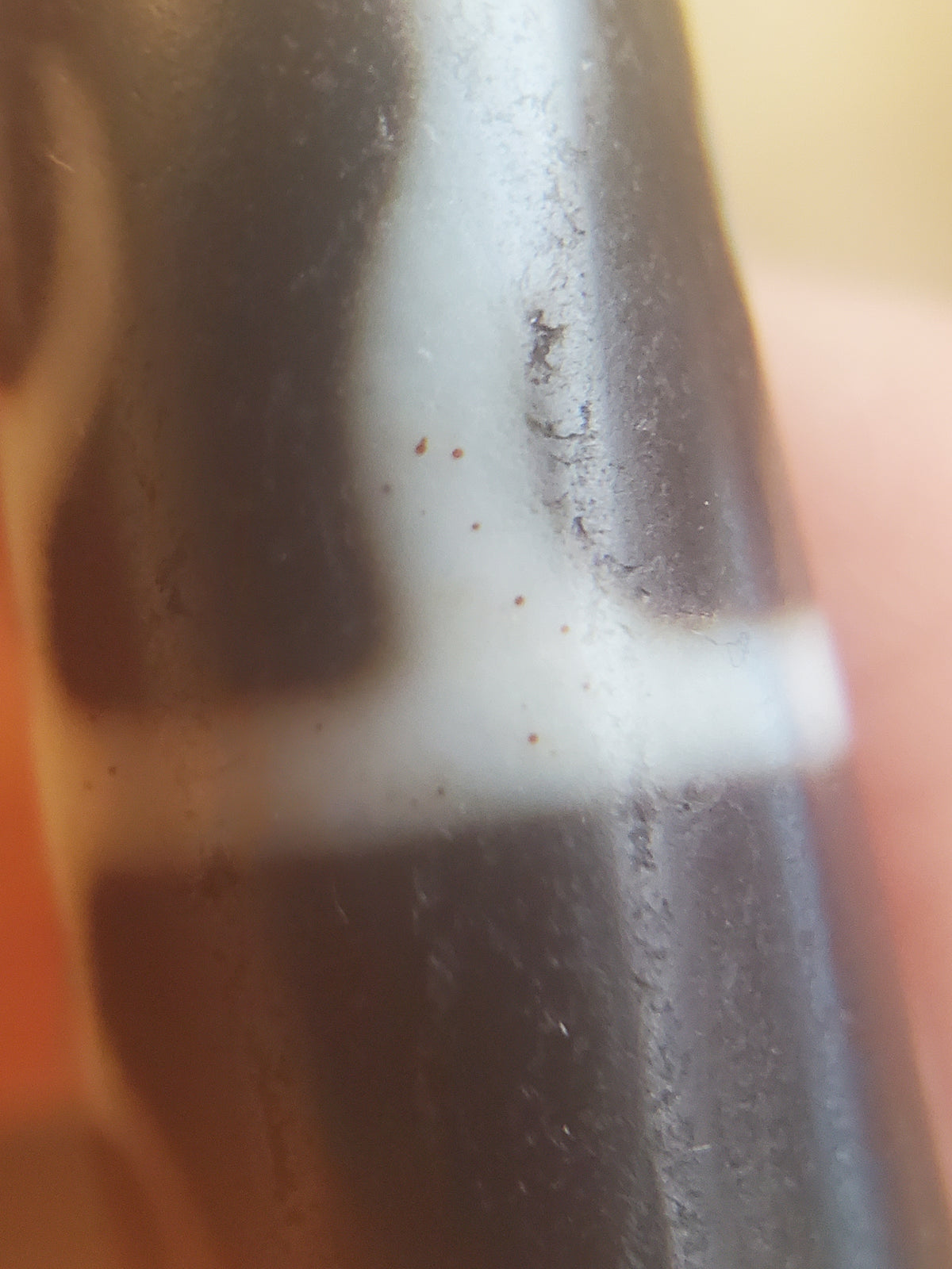 Antique Dzi bead Guru Rinpoche scepter motif white cross pattern on dark agate with red bloodspots and aged patina