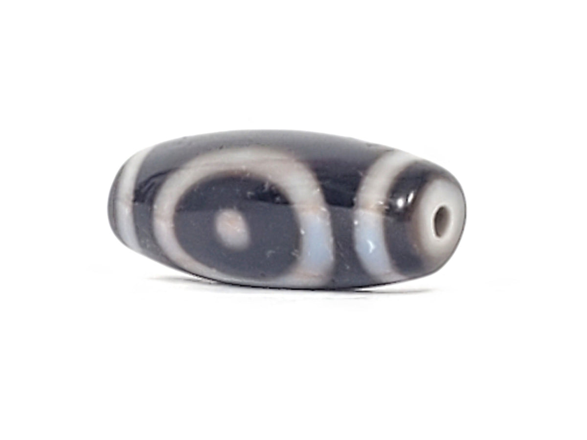 Antique heaven earth gate dzi — opposite end angled, drill hole at near tip, oval arc motifs on charcoal body, At-0426-HGEG