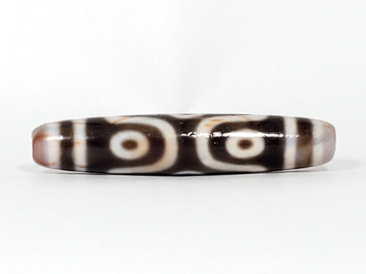At-082824-6EBS2 face C angular eye frame radiating white lines deep dark warm-brown dzi unretouched