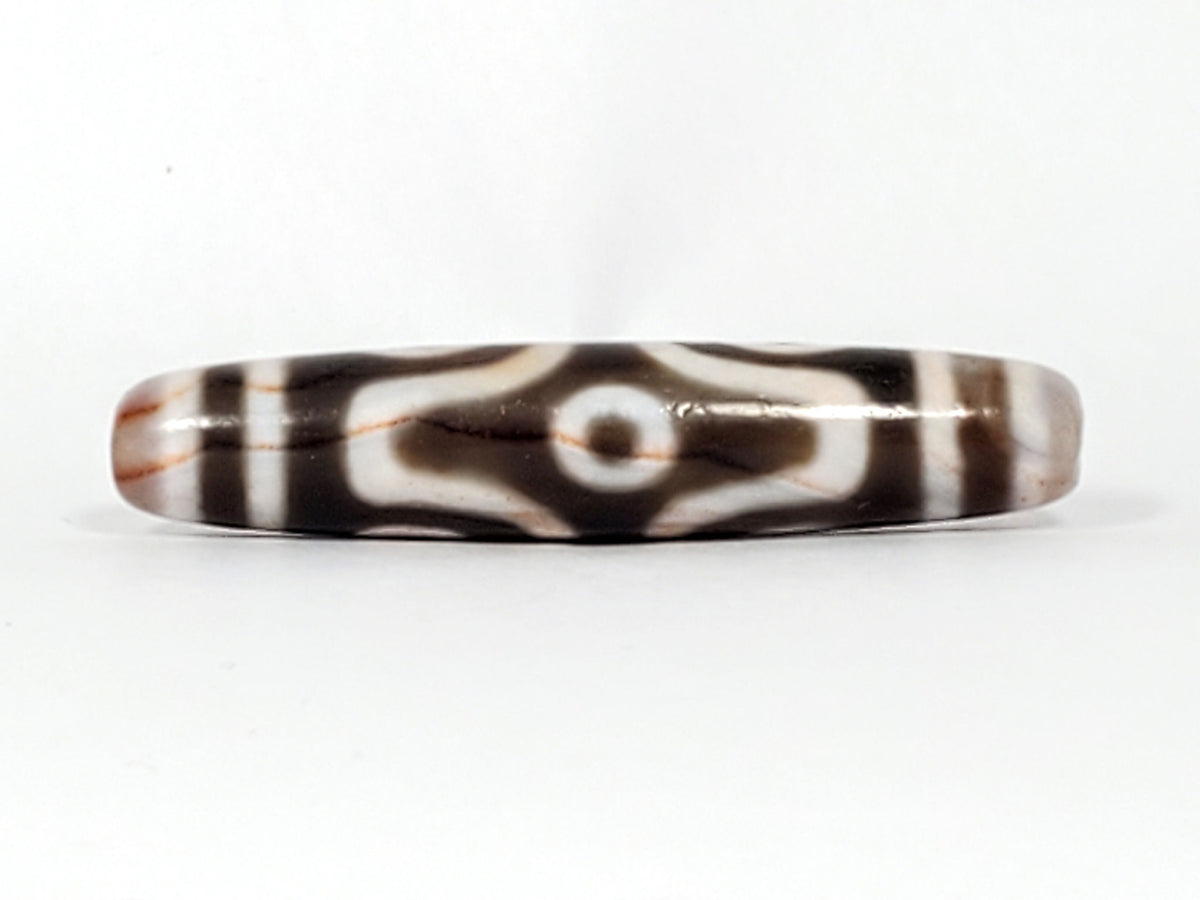 At-082824-6EBS2 face D two rounded open-ring eyes warm brown cinnabar tint dzi unretouched