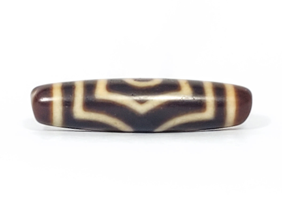 Antique three-eye dzi bead, dark brown agate, cream white etched eye motifs, smooth polished surface, aged patina