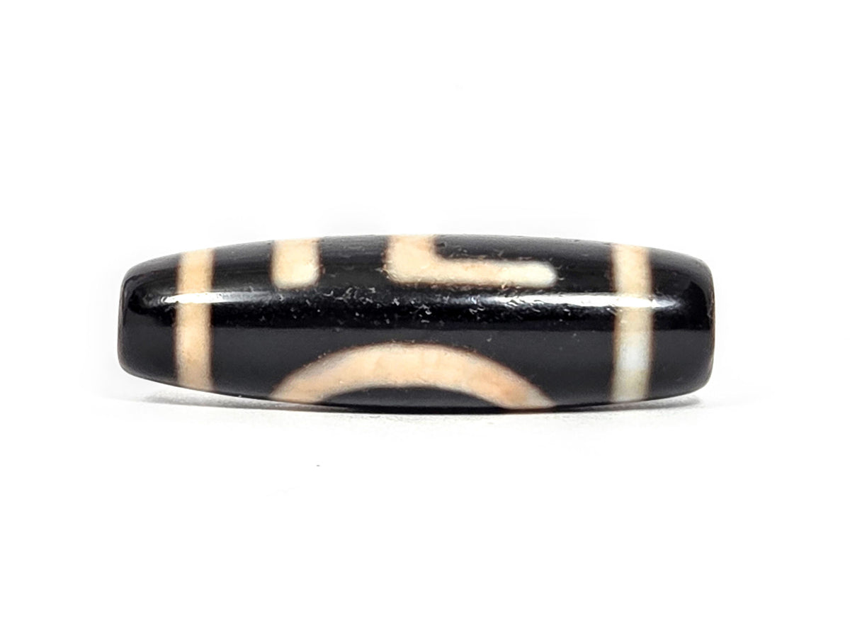 At-072326-1ESWBS antique one eye yungdrung dzi pitch-black agate transitional face eye arc swastika emerging unretouched