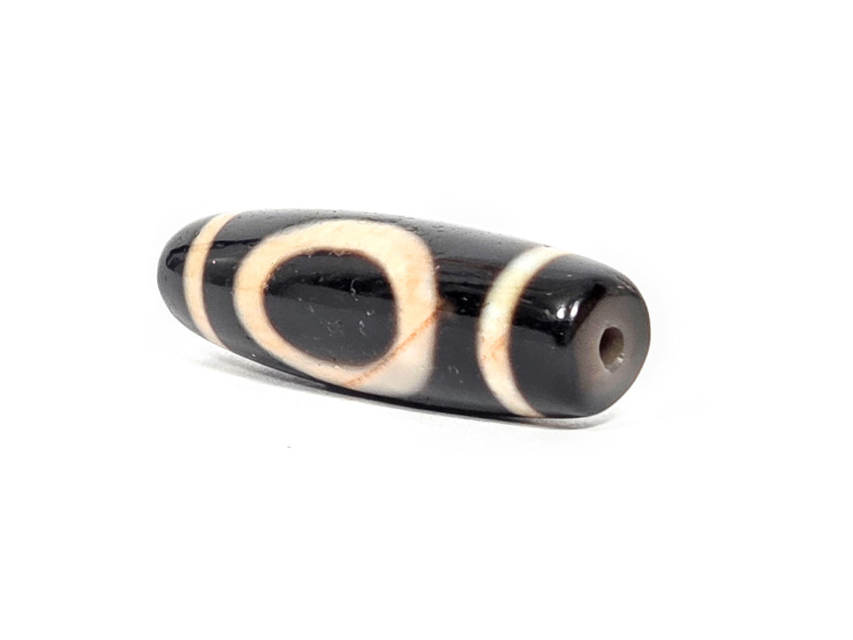 At-072326-1ESWBS antique one eye yungdrung dzi drill end B pitch-black tip eye ring wrapping visible unretouched