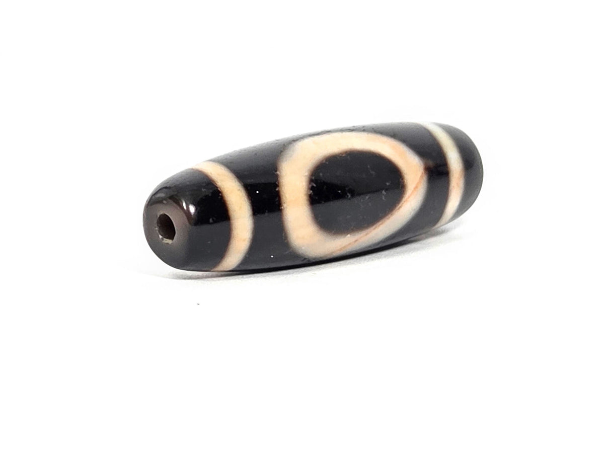 At-072326-1ESWBS antique one eye yungdrung dzi drill end A pitch-black tip small clean drill hole unretouched