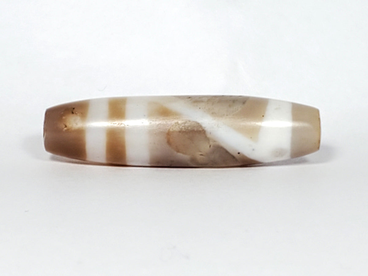 Ancient Tibetan double mountain dzi bead, etched agate, brown white stripes, elongated barrel shape, aged patina, natural markings