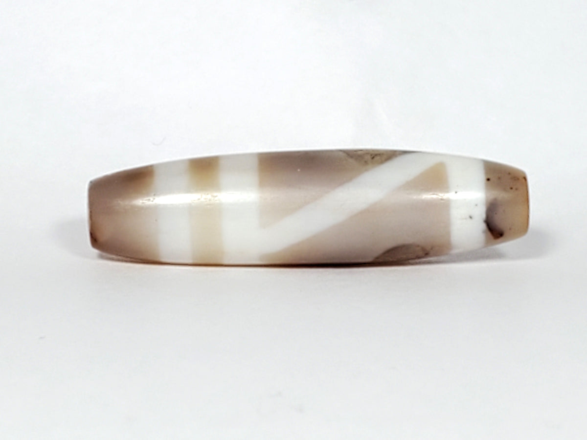 Ancient Tibetan dzi bead double mountain motif etched agate white chevron lines brown patina elongated barrel shape