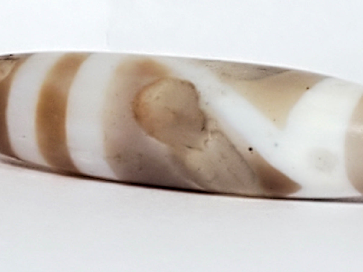 Ancient double mountain motif dzi bead, natural agate, brown cream banding, eye circles, smooth polished surface, white patina