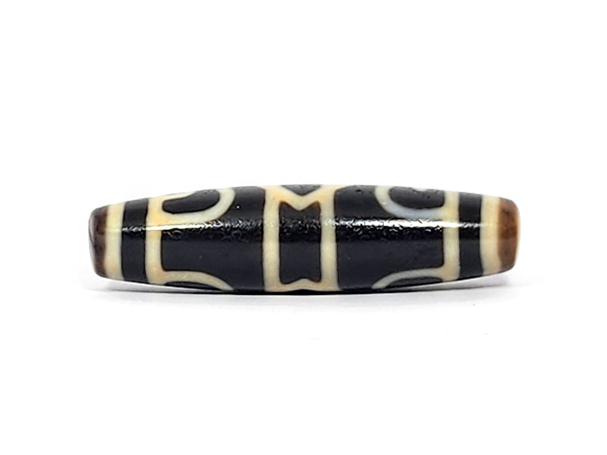 Guru Rinpoche's Dharma Cap Dzi bead, pitch-black agate with cream striping, 49.8mm, polished surface