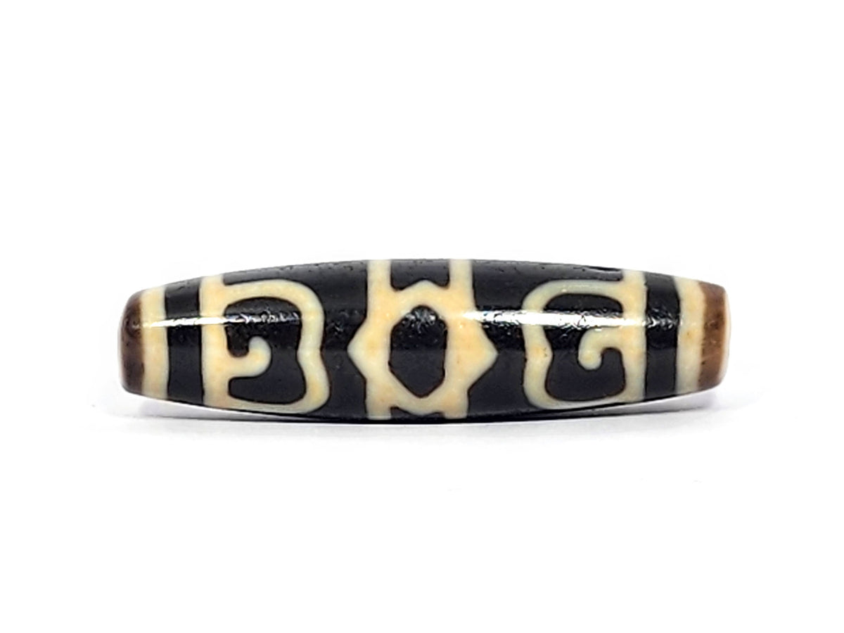 Guru Rinpoche's Dharma Cap Dzi bead, pitch-black agate with cream patterns, drilled through center, 49.8×13.2mm