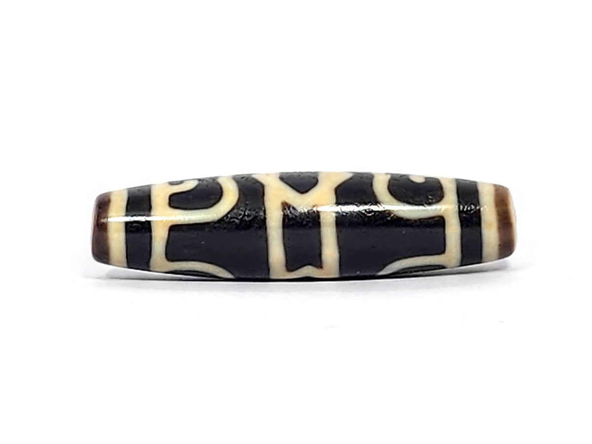 Guru Rinpoche's Dharma Cap Dzi bead, pitch-black agate with cream striping, 49.8×13.2mm, polished surface