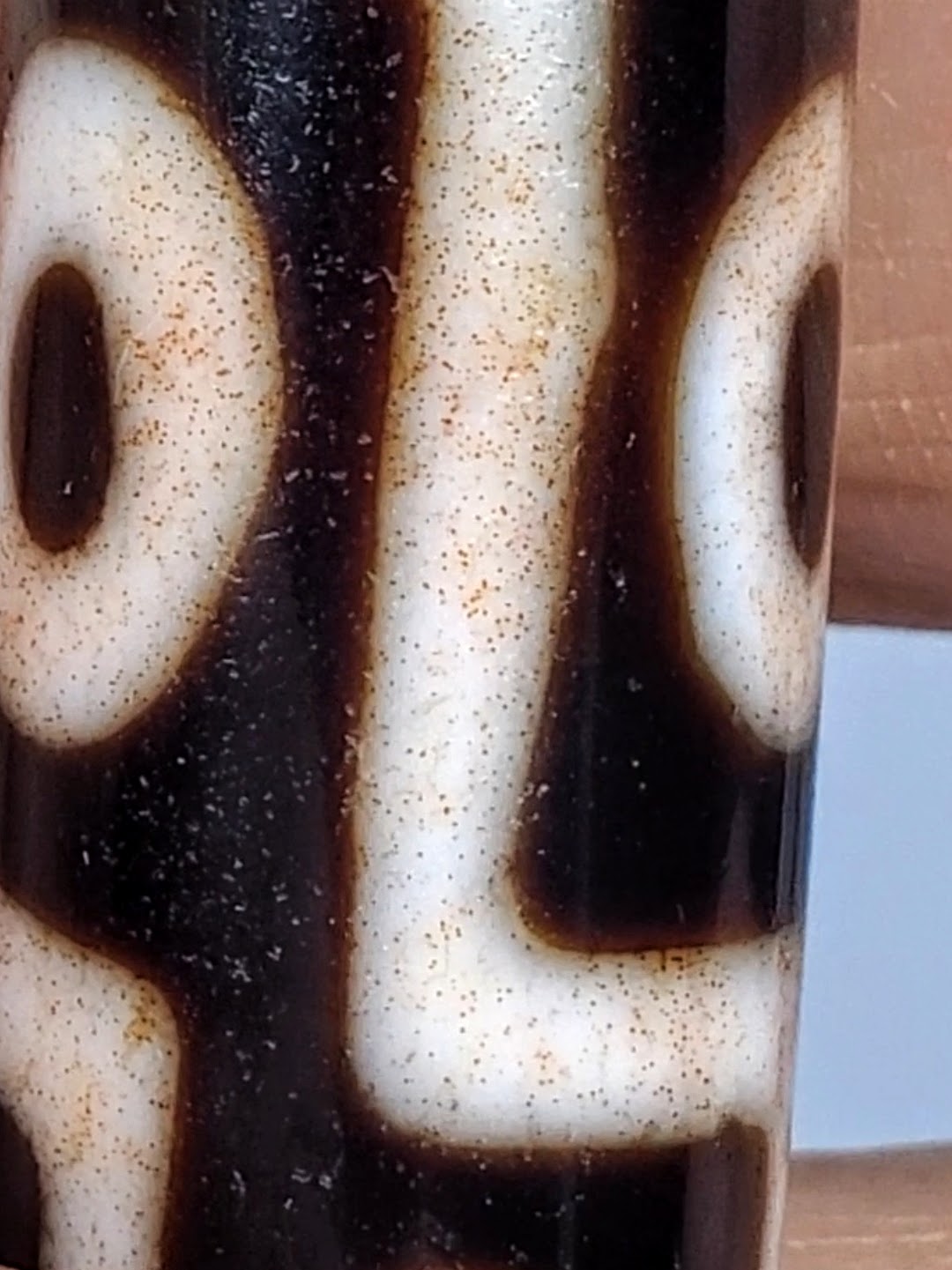 Antique Tibetan nine-eye dzi bead, cream agate with dark brown etched eyes, heavy bloodspots, aged patina, large format