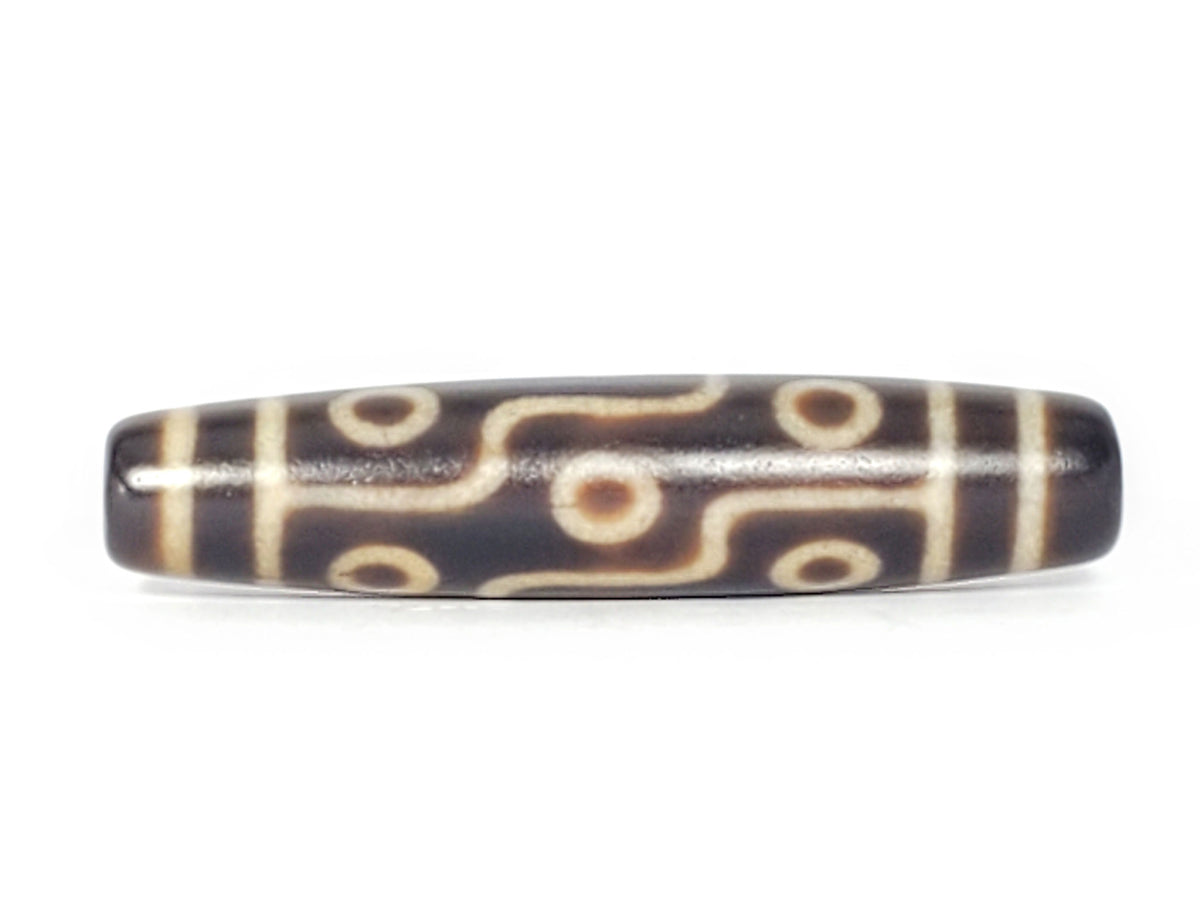 Nine-eye dzi bead, dark brown agate with cream patterns, 58mm barrel shape, polished surface