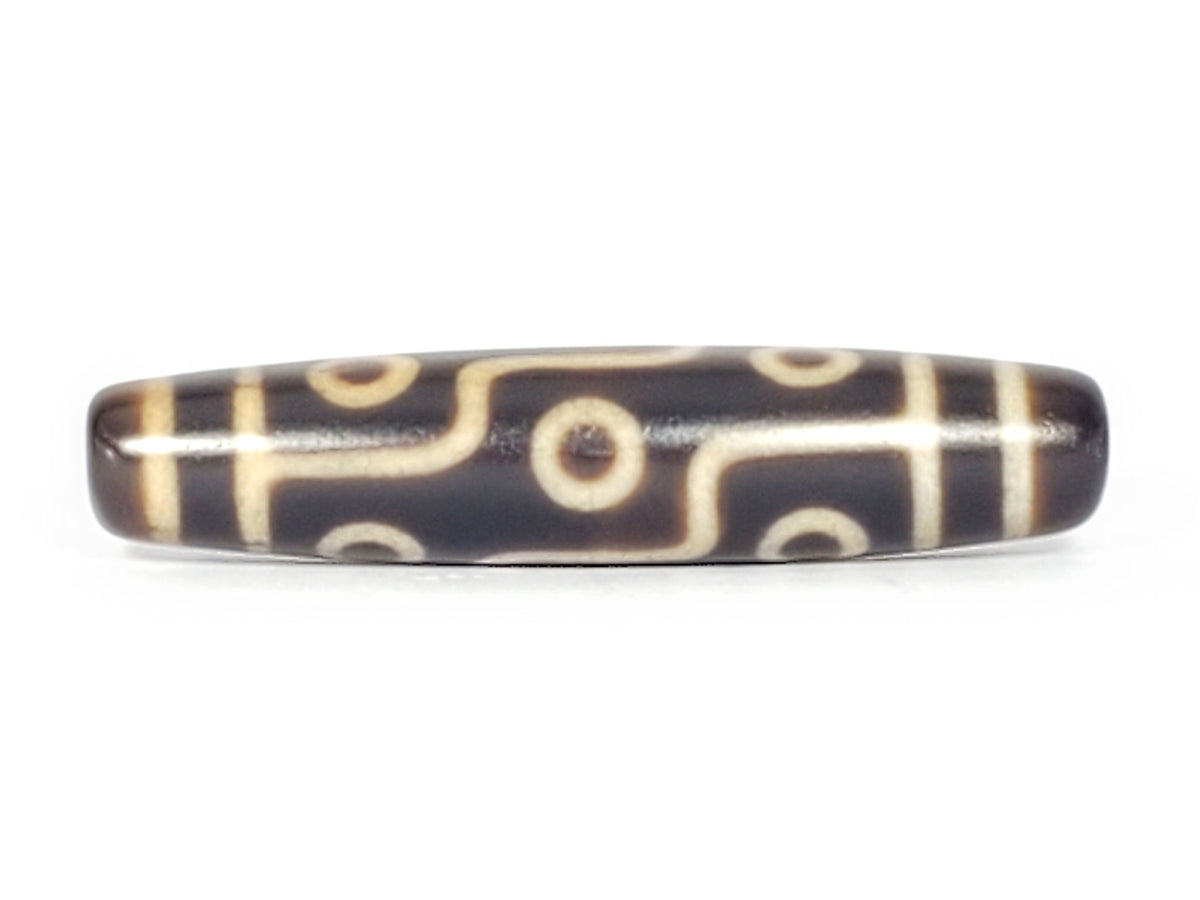 Nine-eye dzi bead, dark brown agate with cream patterns, 58mm barrel shape, polished surface