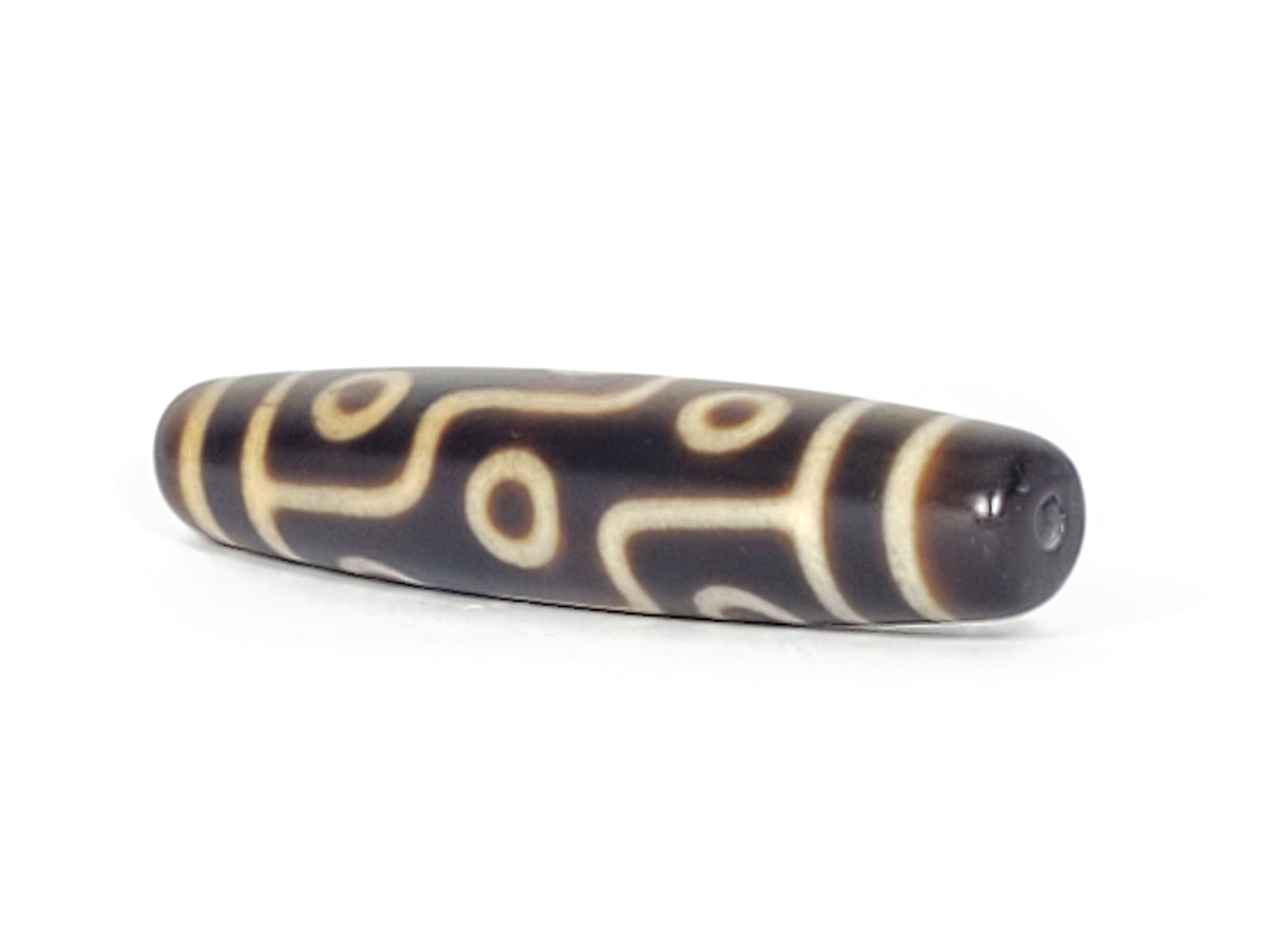 Nine-eye dzi bead, dark brown agate with cream striping and circular motifs, drilled through center