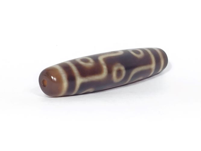 Nine-eye dzi bead with brown and cream agate patterns, drilled hole, polished surface