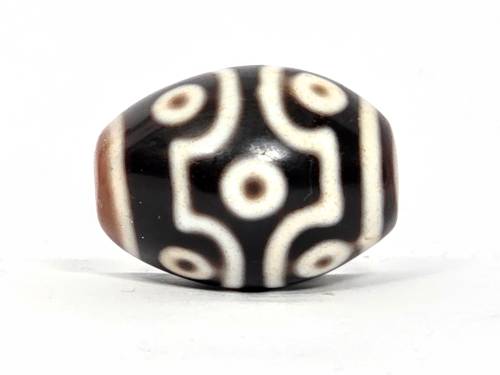 Rare ancient Tibetan nine-eye dzi bead with cream and black agate stripes and natural bloodspots, round polished form