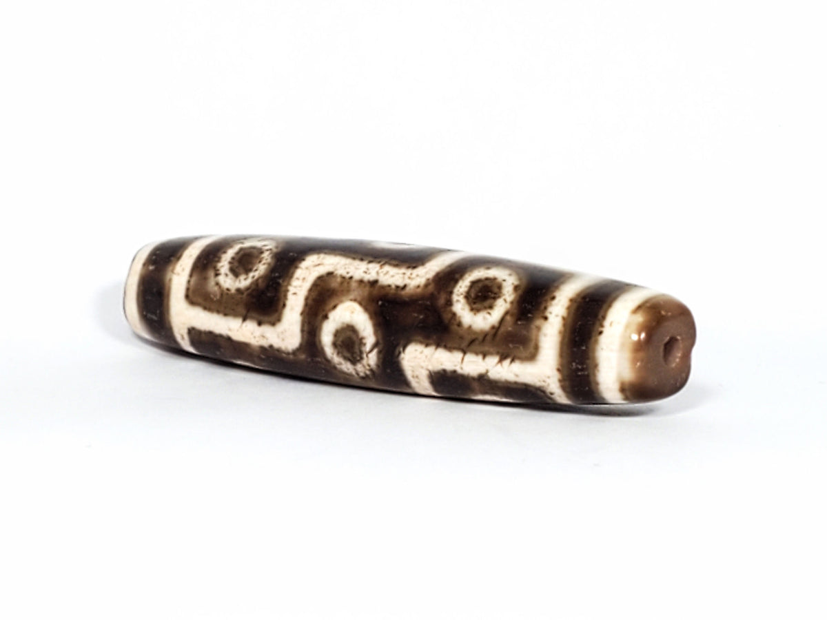 Qing Dynasty nine eye dzi — opposite angled end, drill hole at warm brown tip, nine eye motif on body, At-0426-9EQ