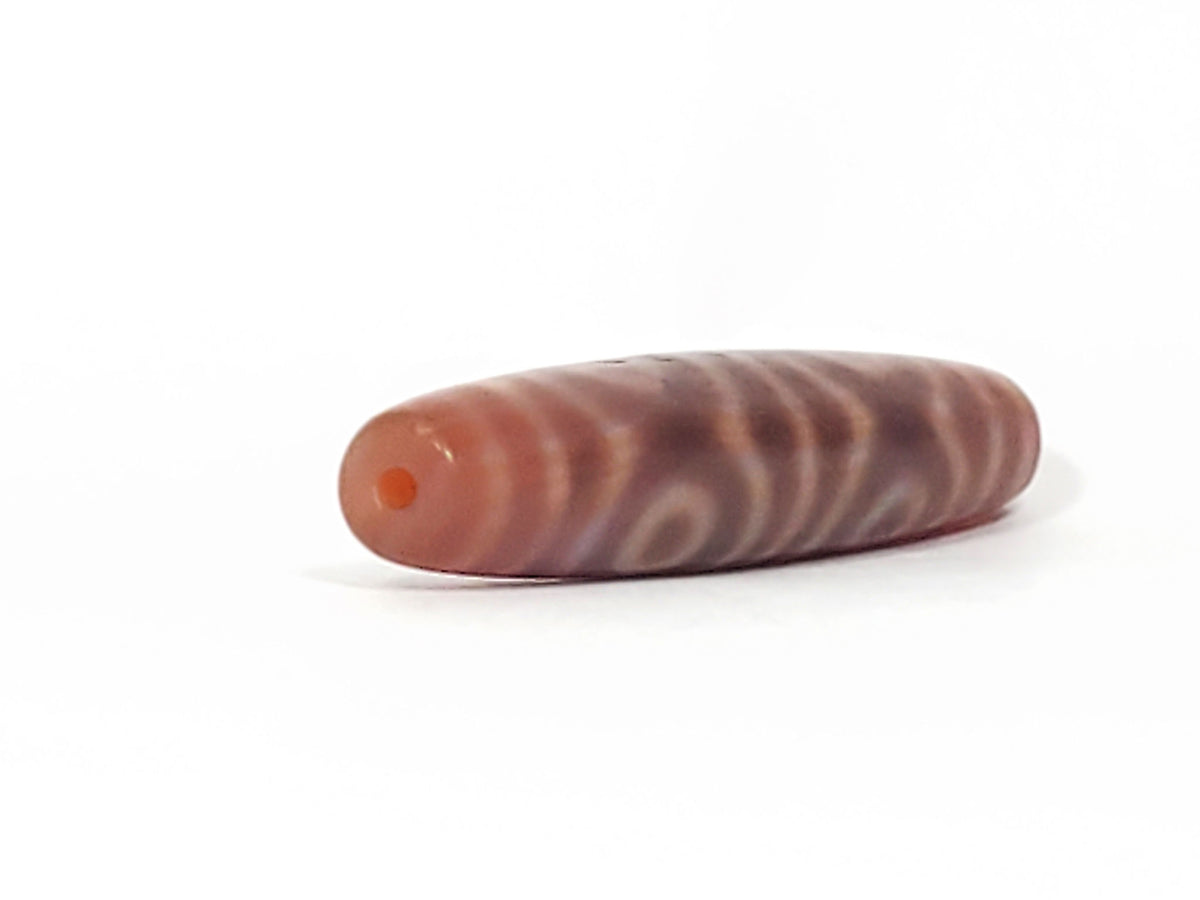 Antique six-eye dzi bead, brownish-red agate, wave etching, visible bloodspot, drill hole, aged patina surface