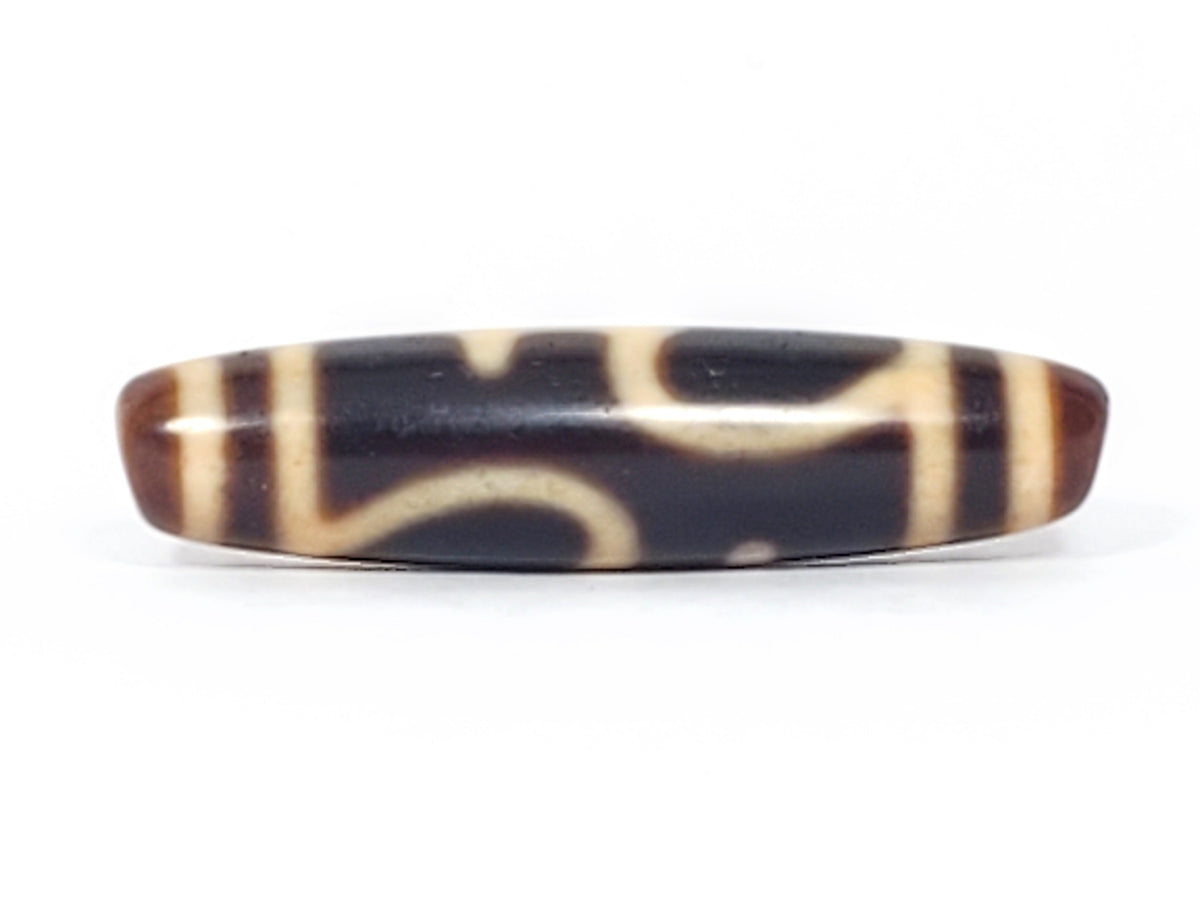 Antique Tibetan dzi bead treasure vase motif, black and cream agate, elongated oval, aged patina, brown tips
