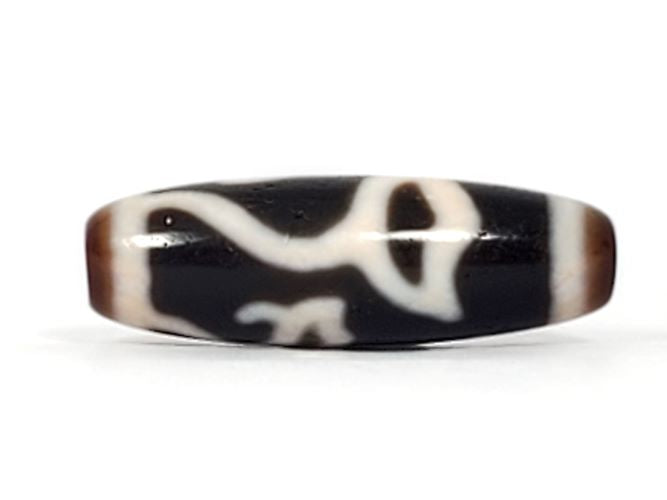 Vintage lotus bud motif dzi bead with bloodspot agate patterning, black and white striped surface detail