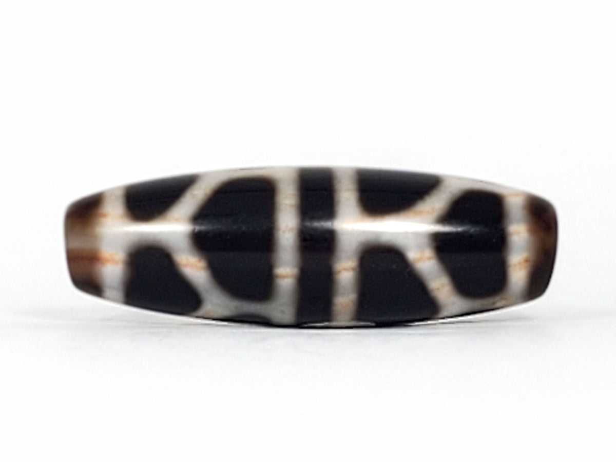 Double longevity dzi bead, pitch-black agate, white grid pattern, cinnabar bloodspots, oval barrel shape, 38.6mm