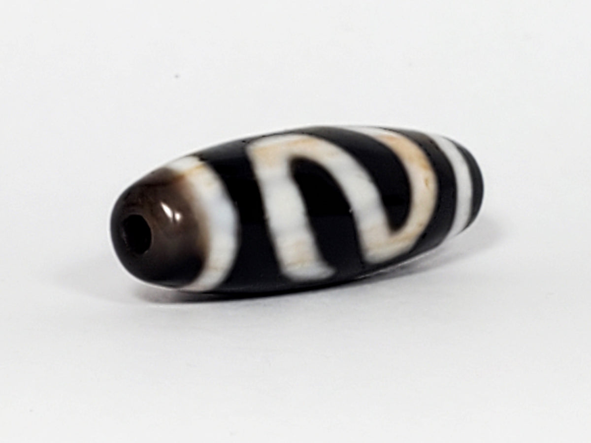 Vintage Money Hook Motif Dzi Bead with black and white agate stripes and natural patina