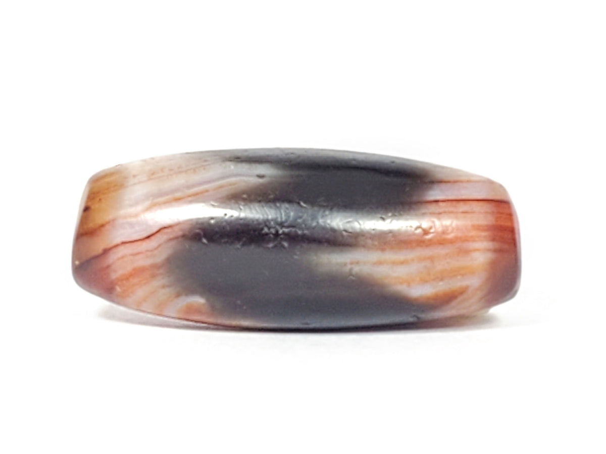 End view of antique Tasso dzi bead showing drill hole, grey-black and reddish-brown natural agate, At-052526-TaBS