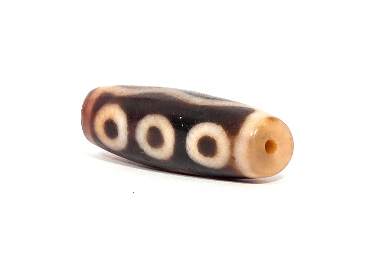 At-072326-5E antique five eye dzi drill end A warm orange-tan agate-internal colour three eyes visible unretouched