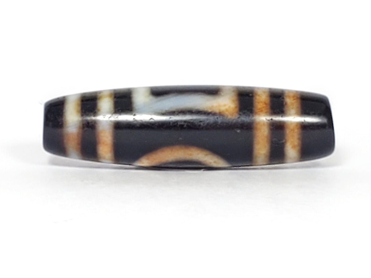 Antique dzi bead Heaven's Gate Earth's Gate motif black agate white brown stripes bloodspots aged patina oval barrel shape